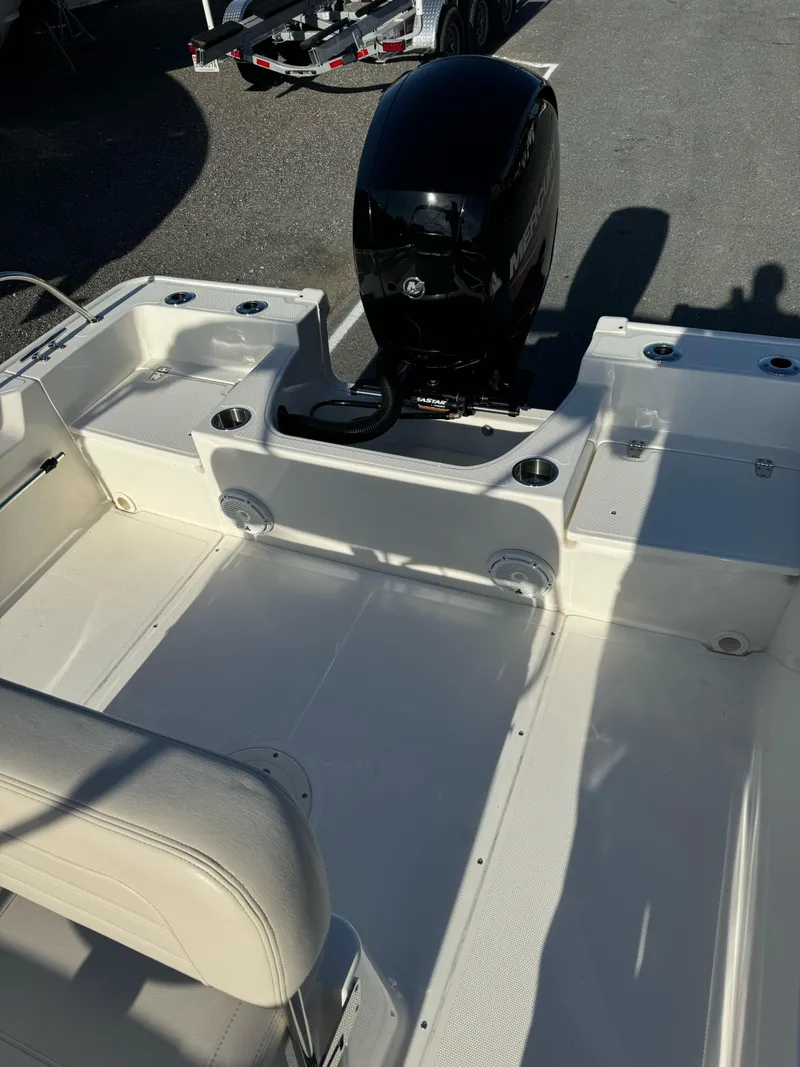 Slide: The Image of 2024 Boston Whaler 190 Montauk boat interior with outboard motor. - 14