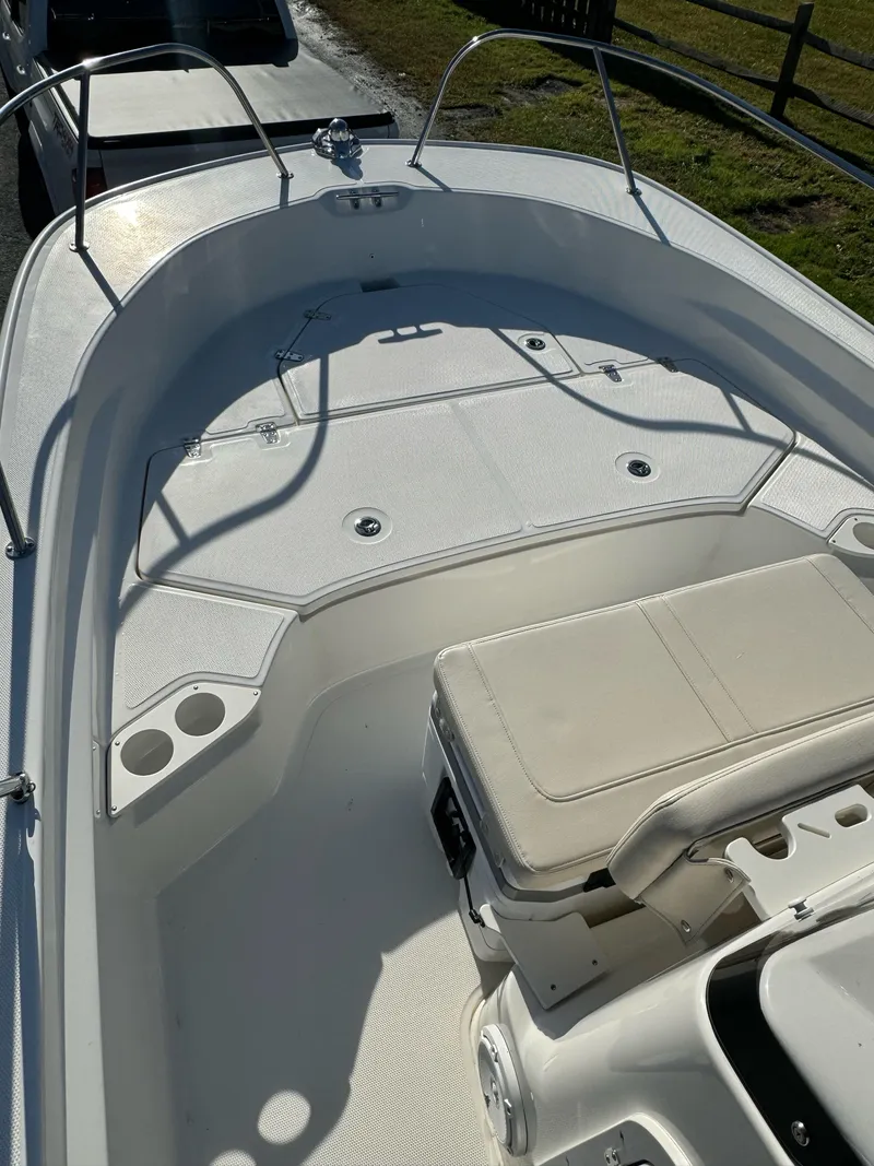 Slide: The Image of 2024 Boston Whaler 190 Montauk boat interior with seating and storage. - 15