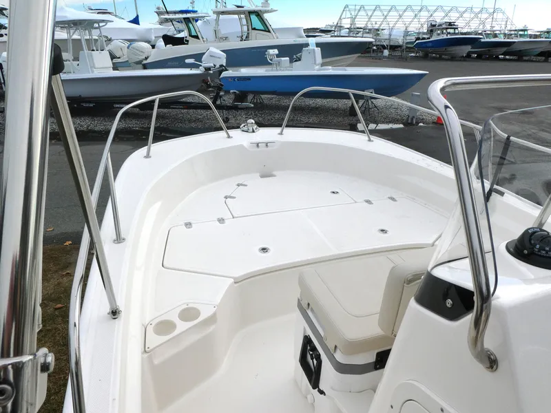 Slide: The Image of 2024 Boston Whaler 190 Montauk boat interior with seating and storage. - 7