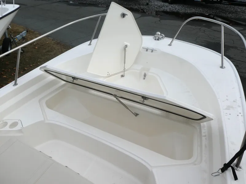 Slide: The Image of 2024 Boston Whaler 190 Montauk boat with open storage compartment. - 8