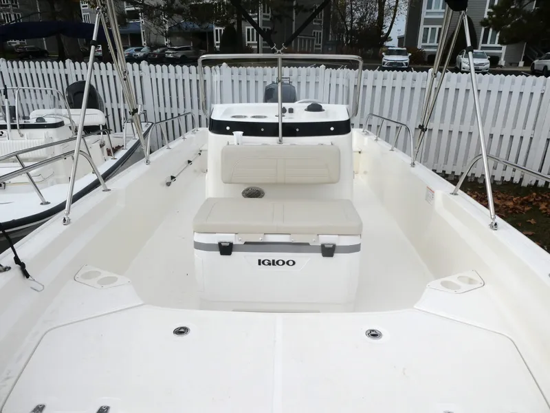 Slide: The Image of 2024 Boston Whaler 190 Montauk boat interior with Igloo cooler and seating. - 9