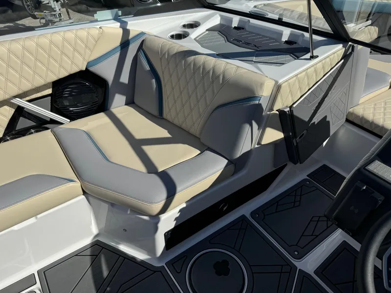 Slide: The Image of 2025 Tigé 22RZX boat interior with beige and gray diamond-stitched seating. - 11