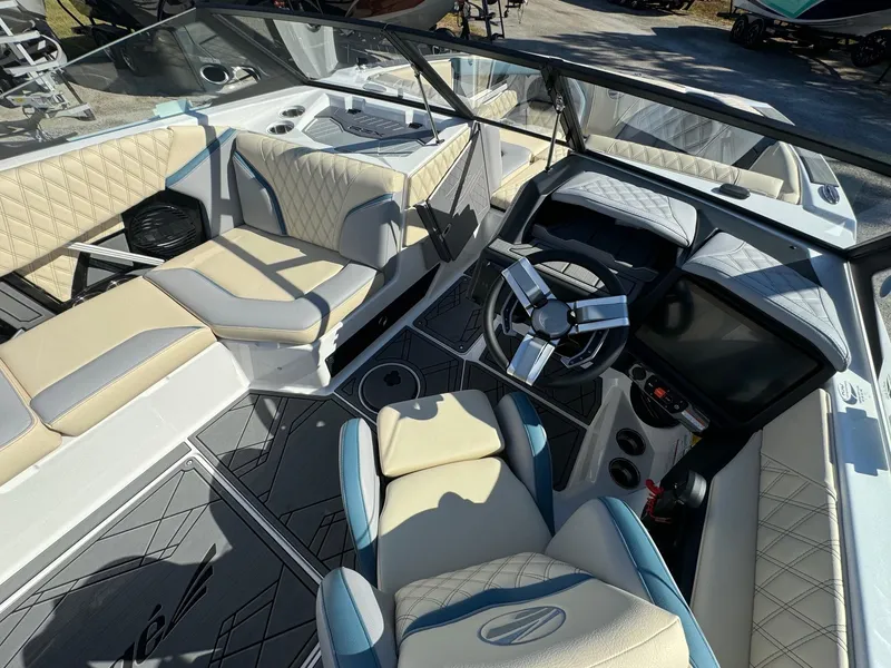 Slide: The Image of 2025 Tigé 22RZX boat interior with modern seating and advanced dashboard controls. - 8