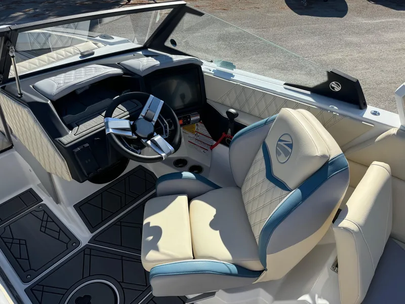 Slide: The Image of 2025 Tigé 22RZX boat interior with luxury seating and modern dashboard. - 9