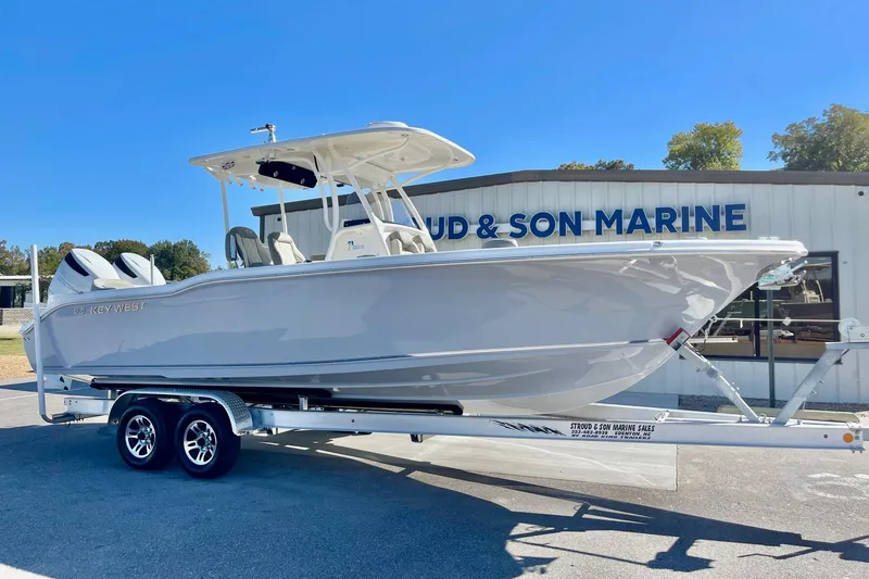 The Image of 2025 Key West 263 FS boat on trailer at marine dealership. - 0