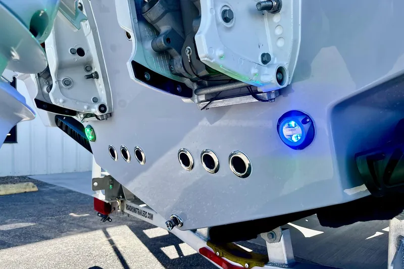 Slide: The Image of Close-up of 2025 Key West 263 FS boat's rear with blue LED lights. - 11