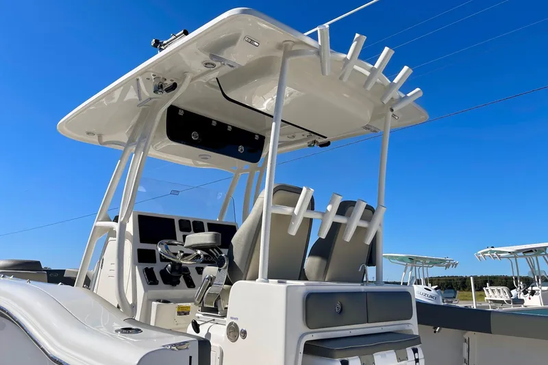 Slide: The Image of 2025 Key West 263 FS boat with T-top and dual helm seats. - 12