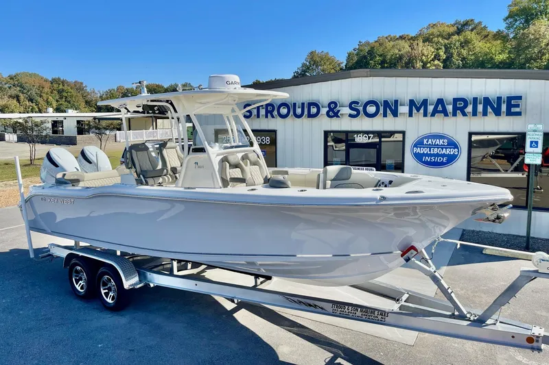 Slide: The Image of 2025 Key West 263 FS boat on trailer at Stroud & Son Marine dealership. - 14