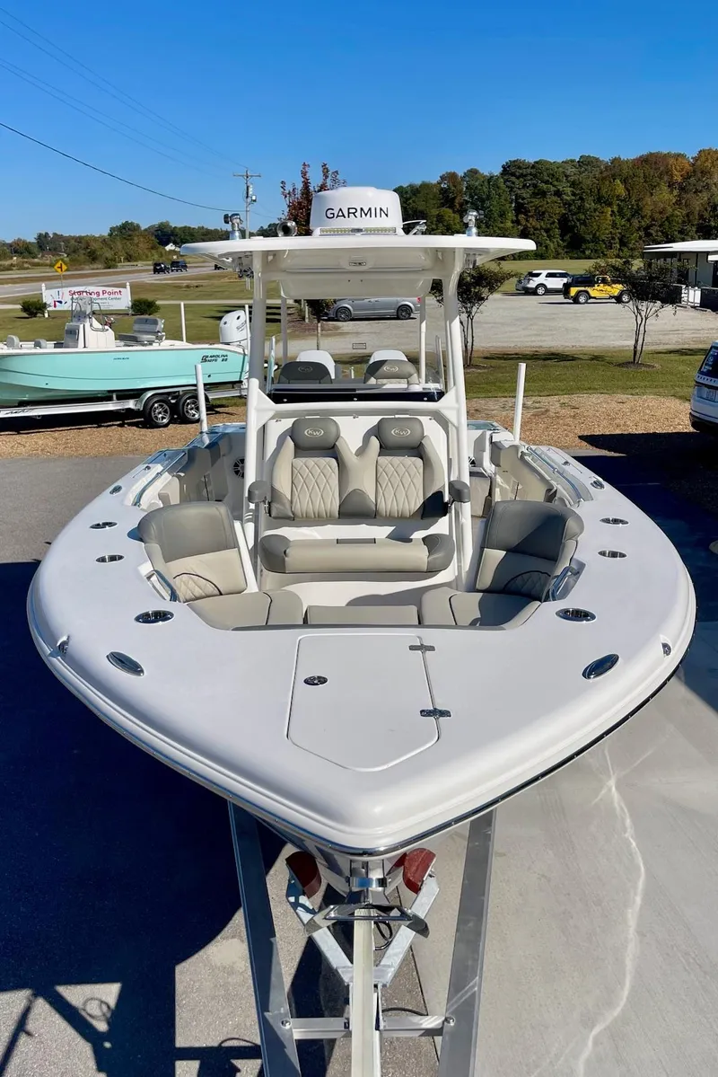 Slide: The Image of 2025 Key West 263 FS boat with Garmin equipment, displayed outdoors. - 15