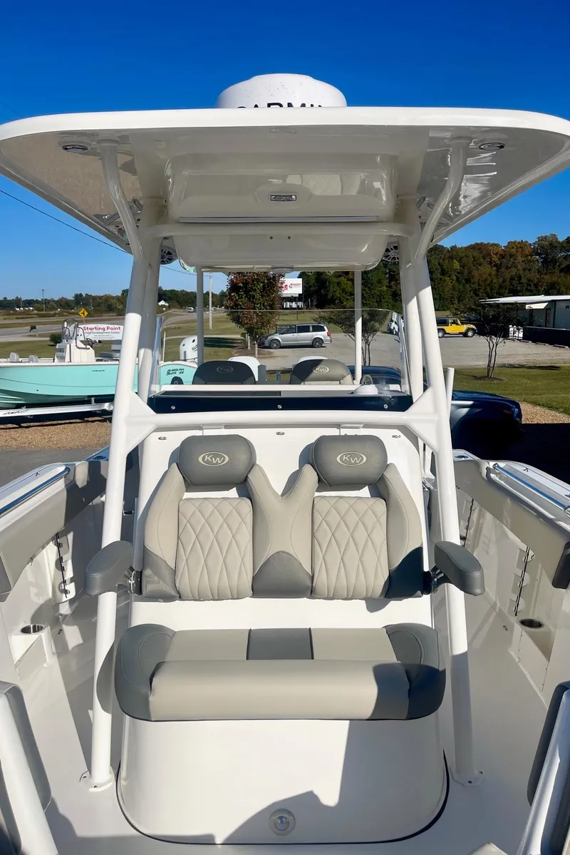 Slide: The Image of 2025 Key West 263 FS boat interior with dual seats and canopy. - 18