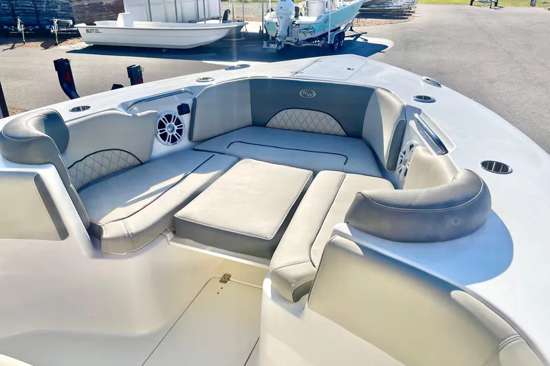 Slide: The Image of 2025 Key West 263 FS boat interior with cushioned seating and speaker system. - 22