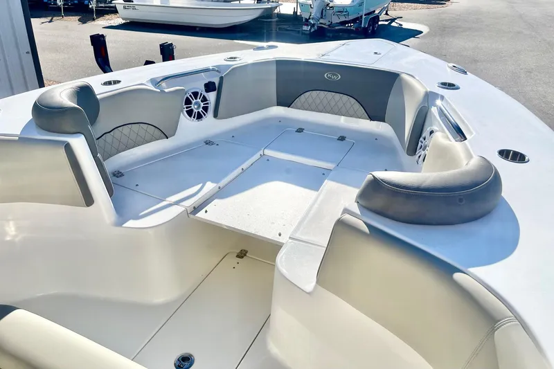Slide: The Image of 2025 Key West 263 FS boat interior with cushioned seating and storage compartments. - 23