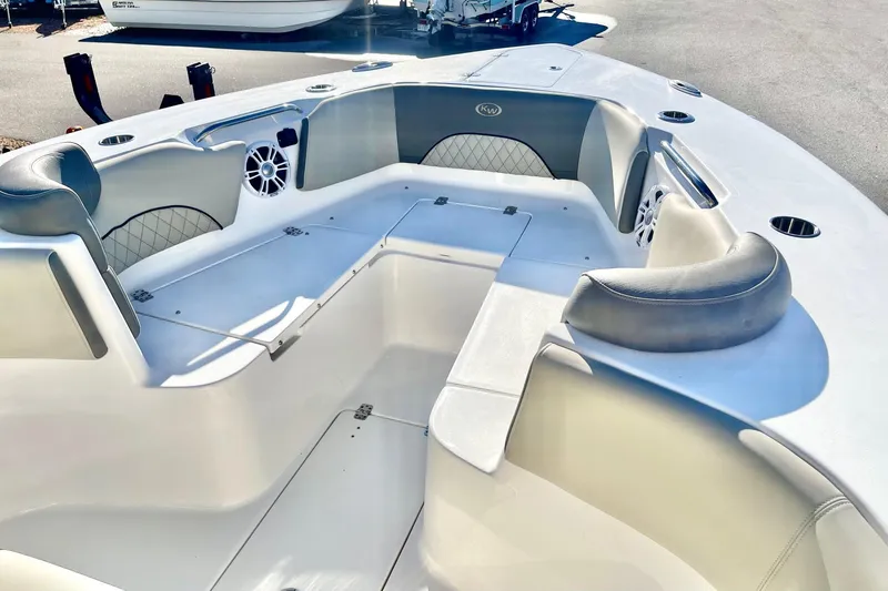Slide: The Image of 2025 Key West 263 FS boat interior with cushioned seating and modern design. - 24