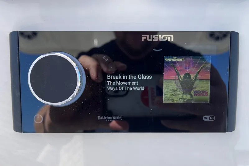 Slide: The Image of Fusion stereo display on 2025 Key West 263 FS, playing "Break in the Glass" by The Movement. - 32