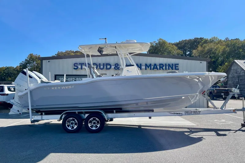 Slide: The Image of 2025 Key West 263 FS boat on trailer at marine dealership. - 4