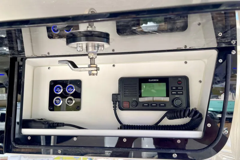 Slide: The Image of Key West 263 FS 2025 boat dashboard with Garmin radio and control panel. - 40