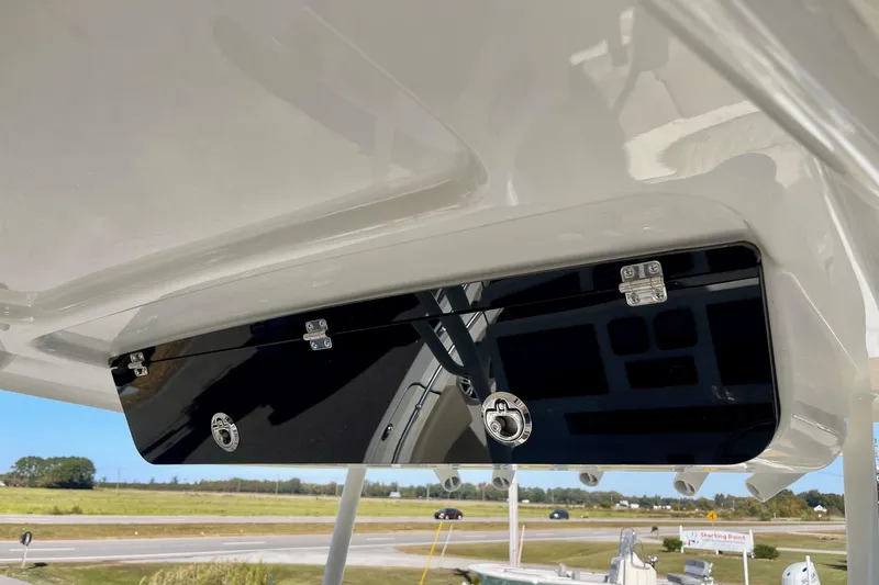 Slide: The Image of 2025 Key West 263 FS boat interior detail with sleek black storage compartment. - 41