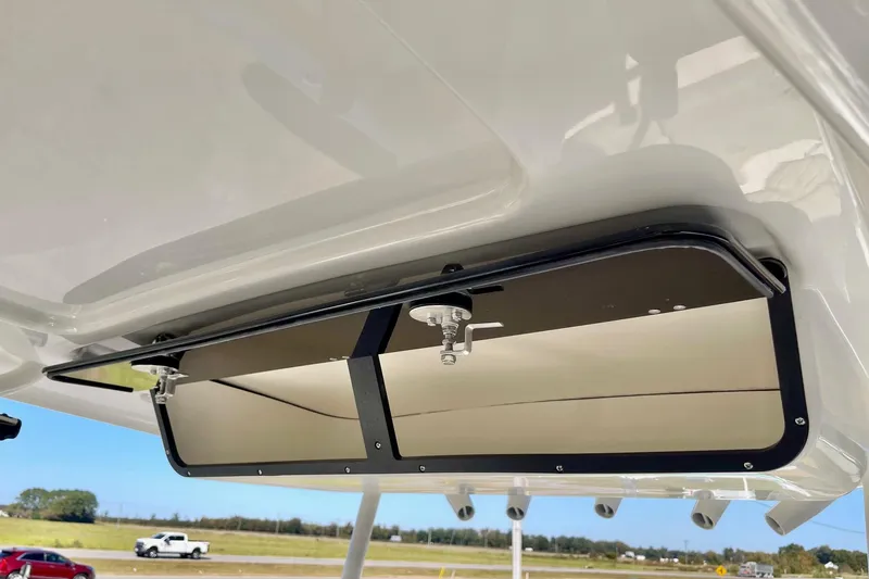 Slide: The Image of 2025 Key West 263 FS boat storage compartment with latch, viewed from below. - 42