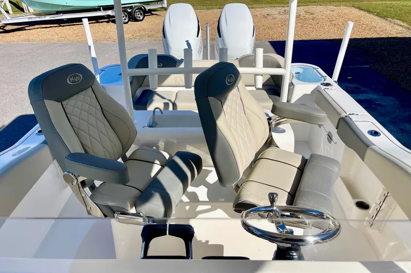 Slide: The Image of 2025 Key West 263 FS boat interior with luxurious seating and steering wheel. - 45