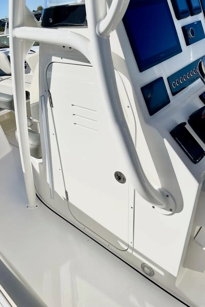 Slide: The Image of 2025 Key West 263 FS boat console with modern controls and sleek design. - 49