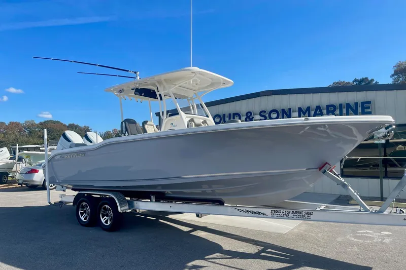Slide: The Image of 2025 Key West 263 FS boat on trailer at a marine dealership. - 6