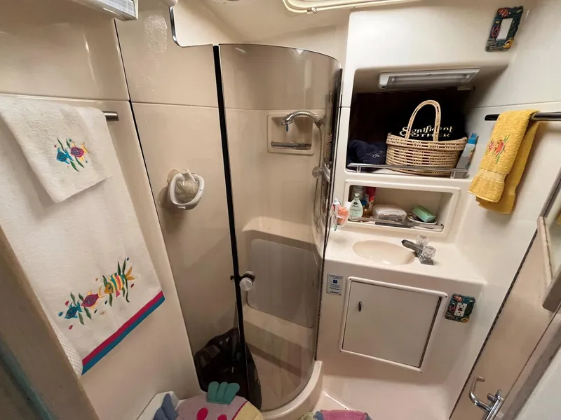 Slide: The Image of Bathroom interior of 1994 Tiara Yachts 3600 Convertible Sportfish with shower and sink. - 12