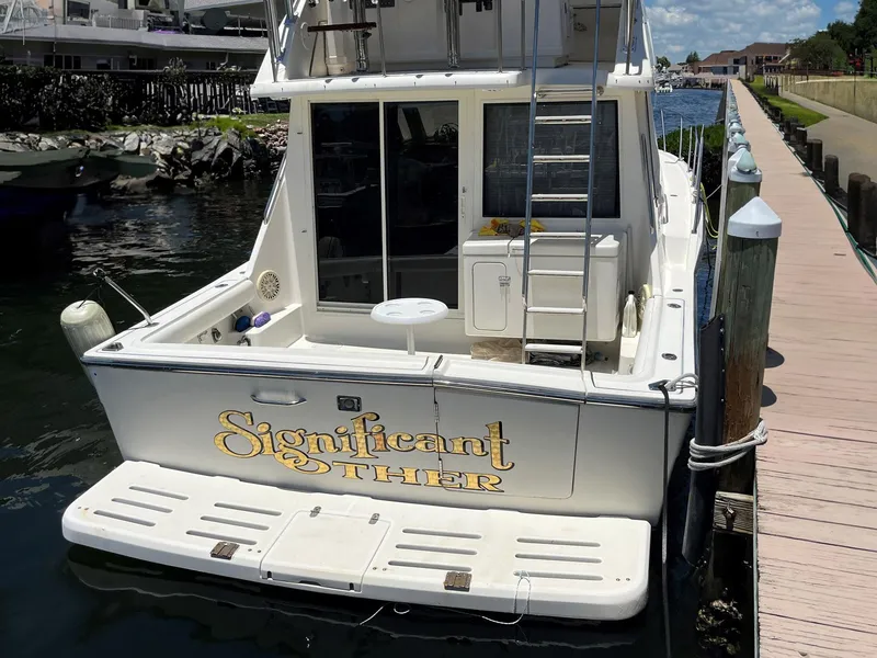 Slide: The Image of 1994 Tiara Yachts 3600 Convertible Sportfish docked, rear view with "Significant Other" name. - 26