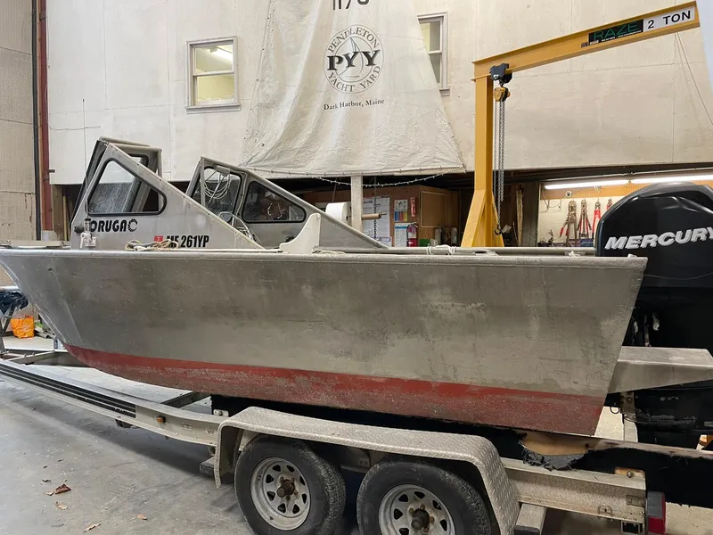 The Image of Custom 2003 work boat on trailer in workshop with Mercury engine. - 0