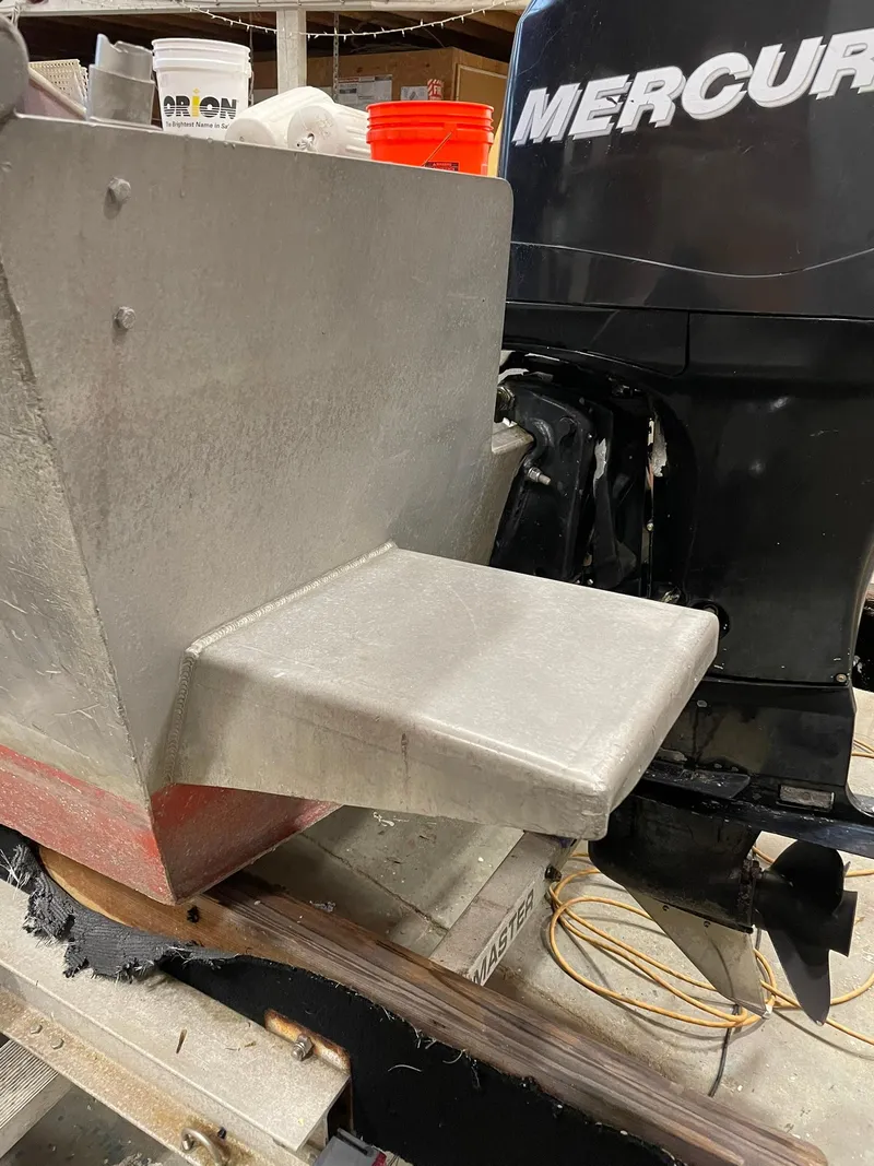 Slide: The Image of Custom 2003 work boat with Mercury engine, docked indoors. - 14