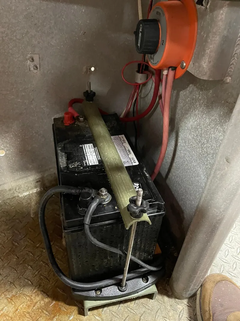 Slide: The Image of Battery setup in a 2003 custom work boat with wiring and switch. - 17