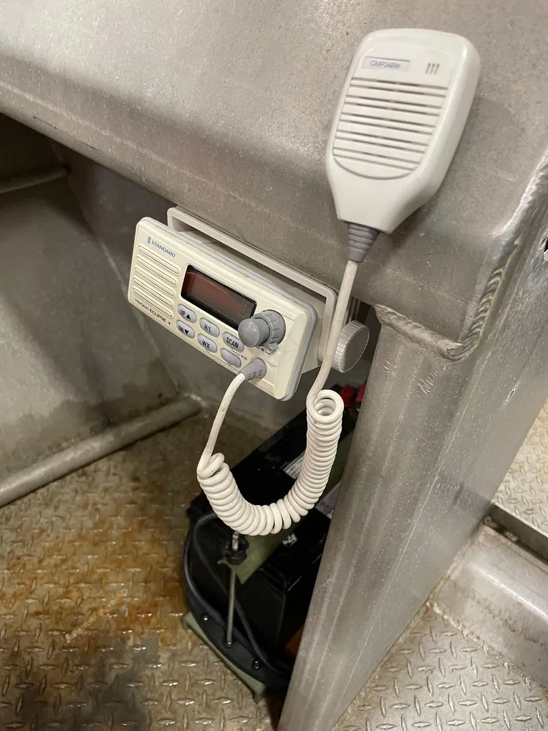 Slide: The Image of Radio communication device on a 2003 custom work boat with microphone and coiled cord. - 20