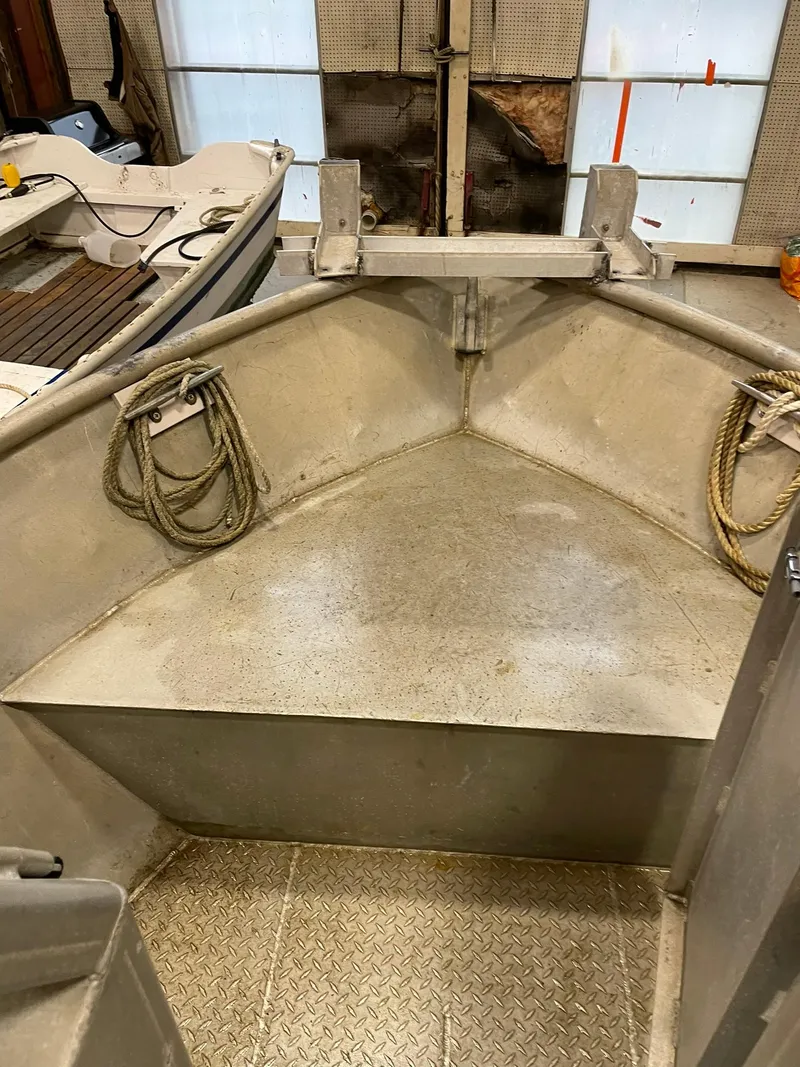 Slide: The Image of Interior of a 2003 custom work boat with ropes and metal flooring. - 24