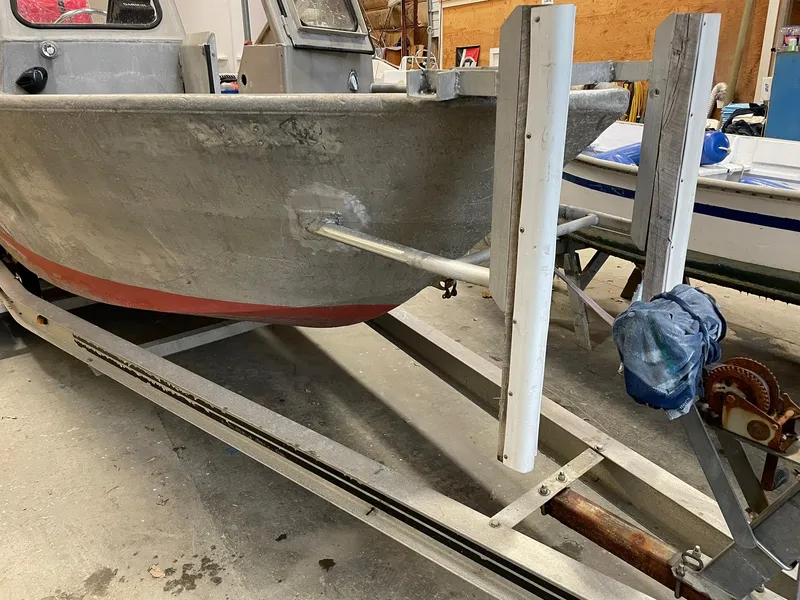 Slide: The Image of Custom 2003 work boat on trailer in a garage setting. - 4