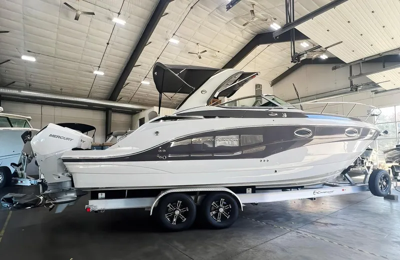 The Image of 2025 Crownline 280 CRX boat on trailer in indoor storage facility. - 0