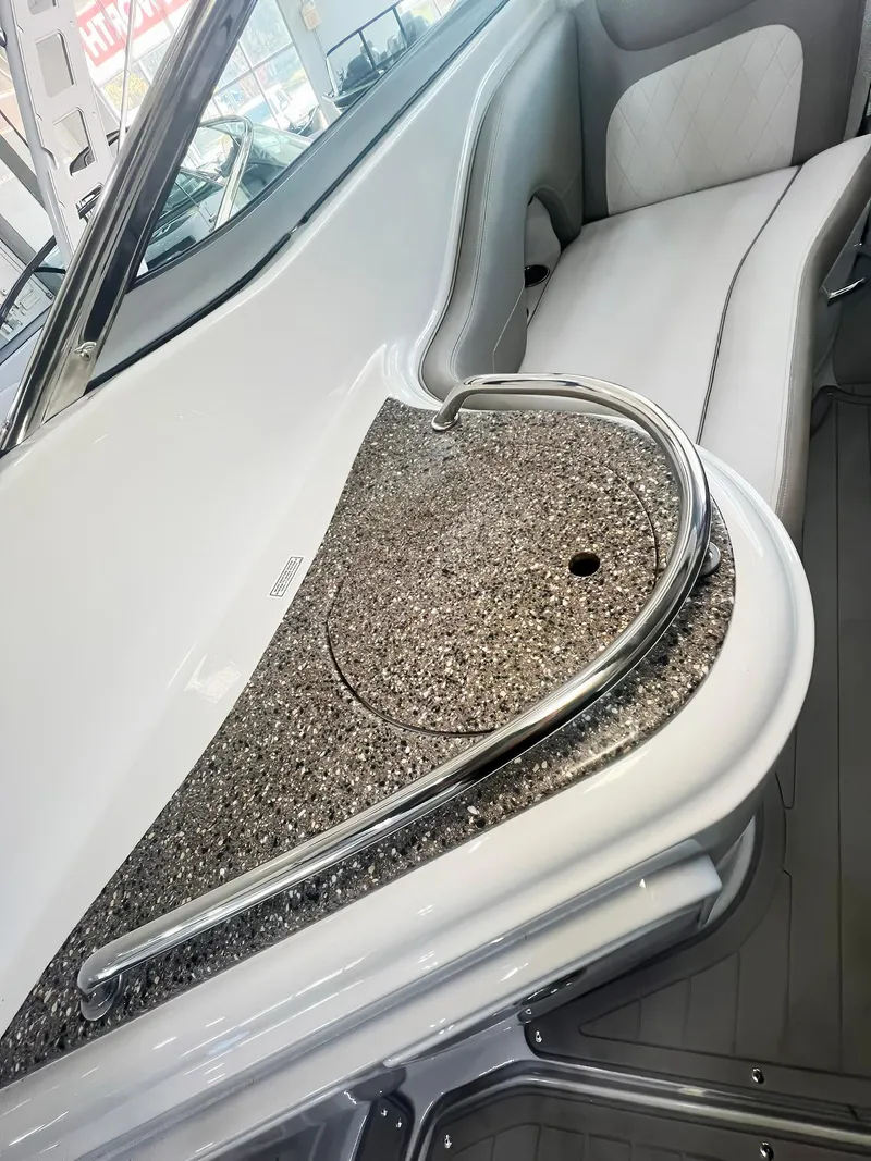 Slide: The Image of 2025 Crownline 280 CRX boat interior with sleek seating and modern design. - 20