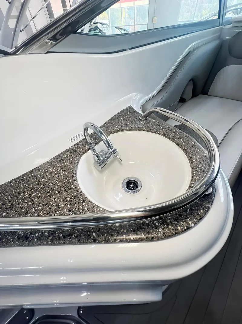 Slide: The Image of 2025 Crownline 280 CRX boat interior with sleek sink and modern design. - 21