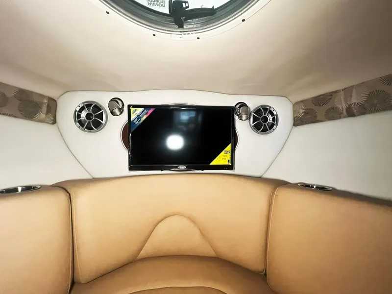 Slide: The Image of Interior of 2025 Crownline 280 CRX boat with TV and speakers. - 32