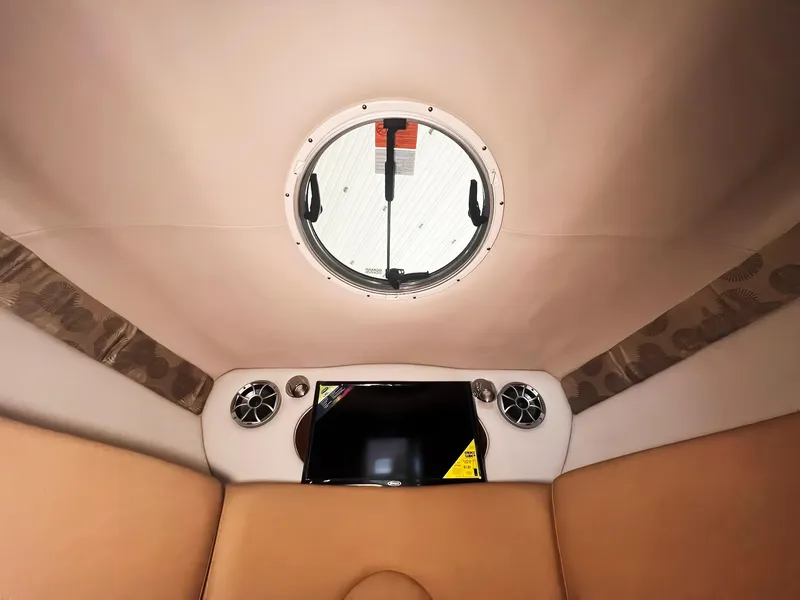 Slide: The Image of Interior cabin of 2025 Crownline 280 CRX boat with porthole and speakers. - 33