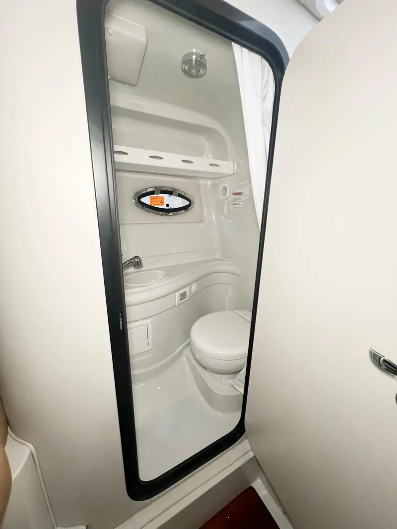 Slide: The Image of 2025 Crownline 280 CRX boat bathroom interior with modern fixtures and compact design. - 40
