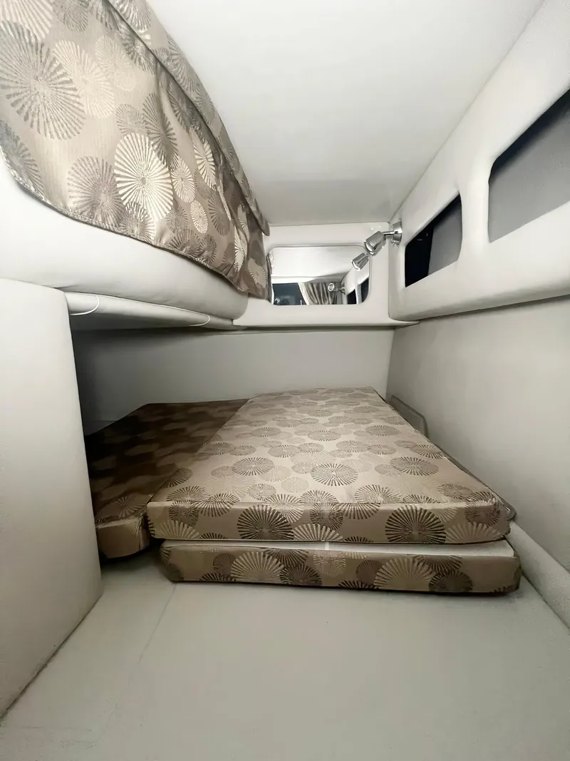 Slide: The Image of 2025 Crownline 280 CRX cabin interior with patterned cushions and sleek design. - 42