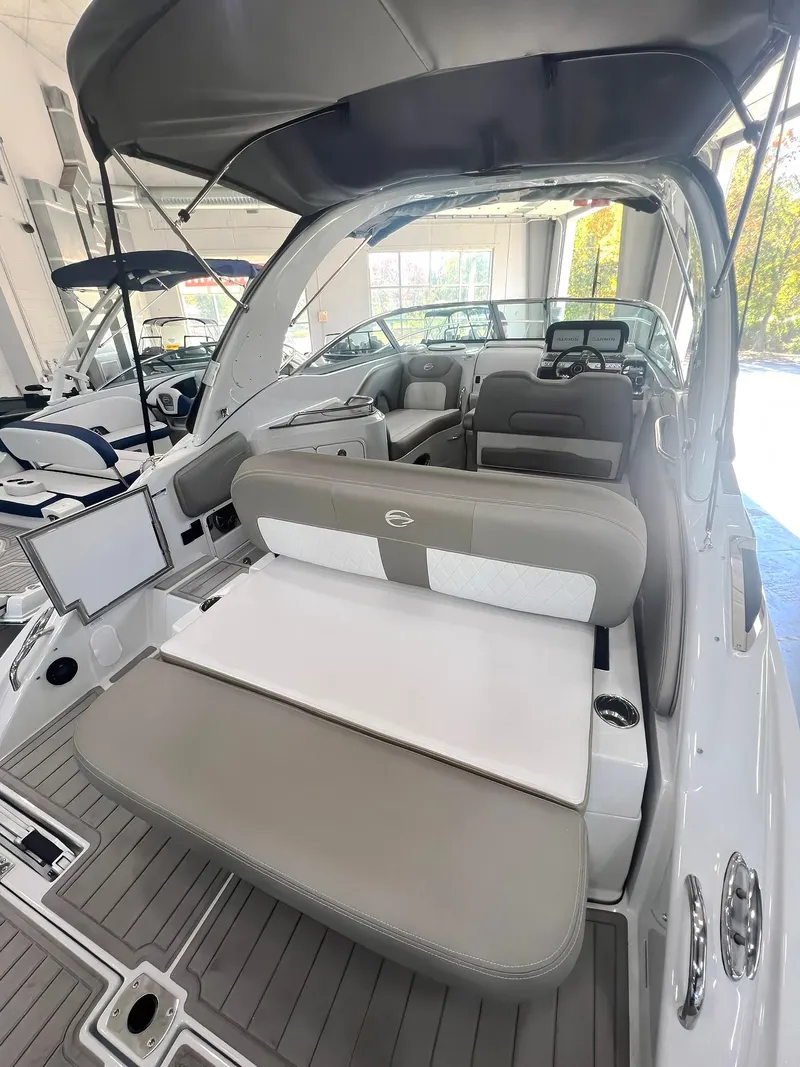 Slide: The Image of 2025 Crownline 280 CRX boat interior with modern seating and dashboard. - 5