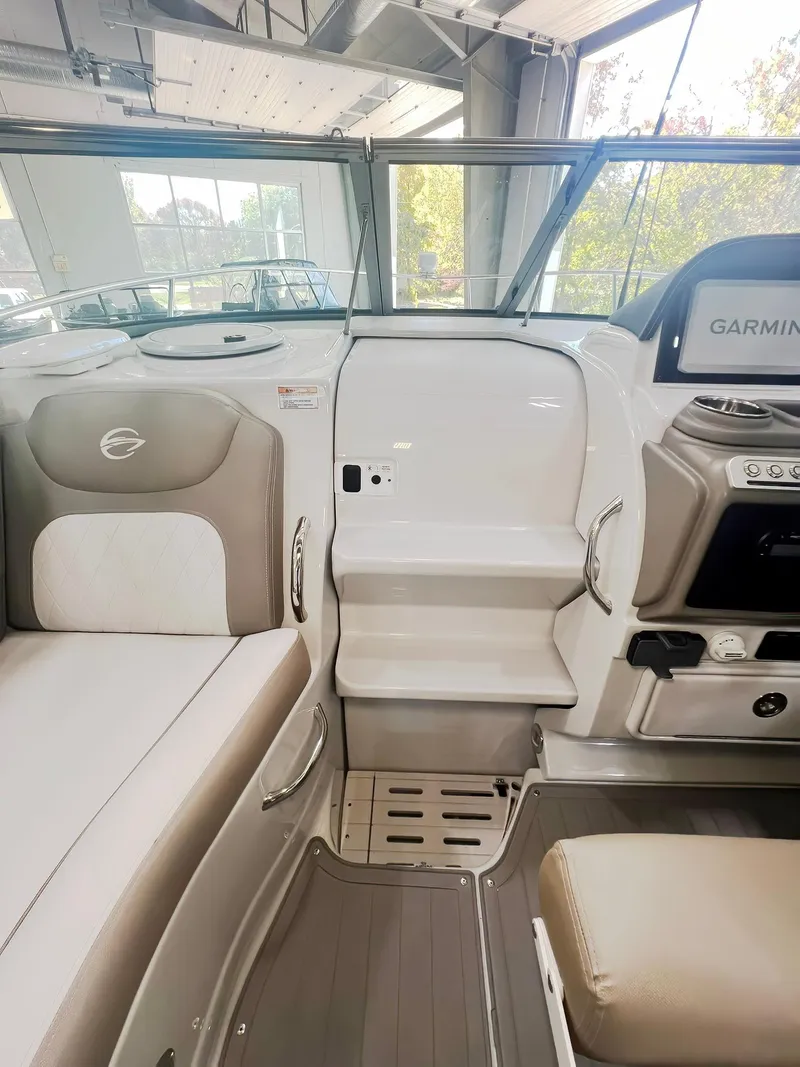 Slide: The Image of 2025 Crownline 280 CRX boat interior with modern seating and navigation system. - 6