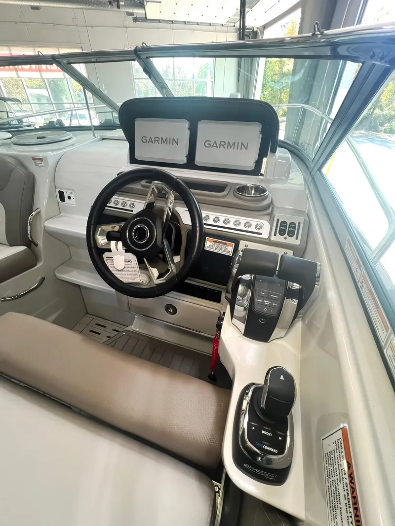 Slide: The Image of 2025 Crownline 280 CRX boat cockpit with Garmin navigation system. - 8