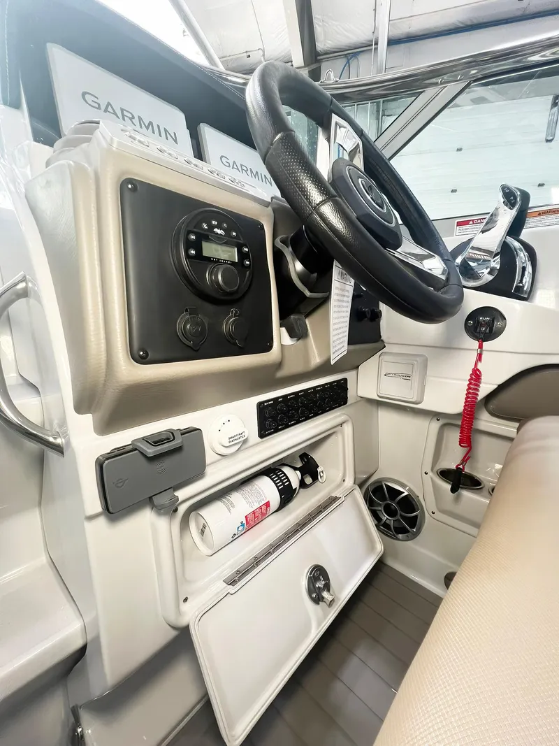 Slide: The Image of 2025 Crownline 280 CRX boat cockpit with Garmin navigation system and modern controls. - 9