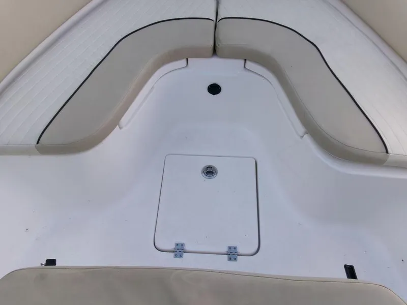 Slide: The Image of 2018 Sea Fox 266 Commander boat interior with cushioned seating and storage hatch. - 10