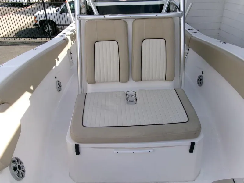Slide: The Image of 2018 Sea Fox 266 Commander boat interior with beige seating and cup holders. - 12