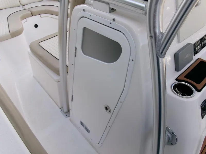 Slide: The Image of 2018 Sea Fox 266 Commander boat interior with seating and storage compartment. - 16