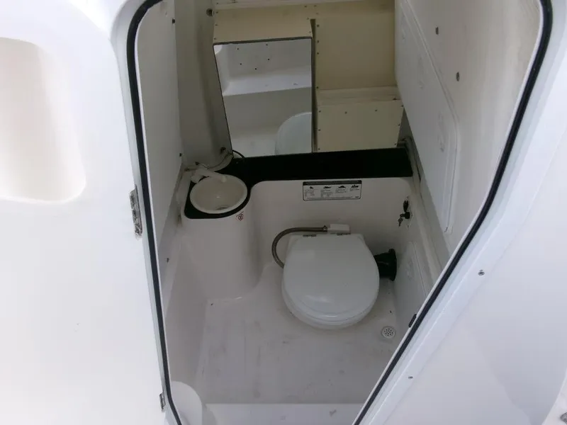 Slide: The Image of 2018 Sea Fox 266 Commander boat interior with toilet and mirror. - 18