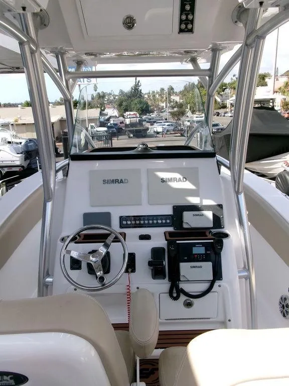 Slide: The Image of 2018 Sea Fox 266 Commander boat dashboard with Simrad electronics and steering wheel. - 20