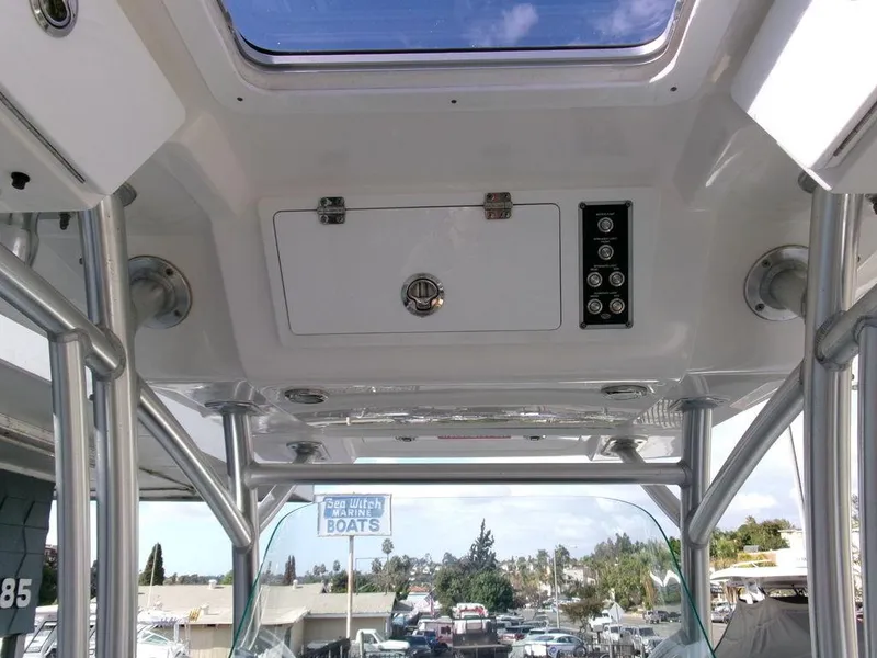 Slide: The Image of Interior view of 2018 Sea Fox 266 Commander boat with control panel and storage compartment. - 22